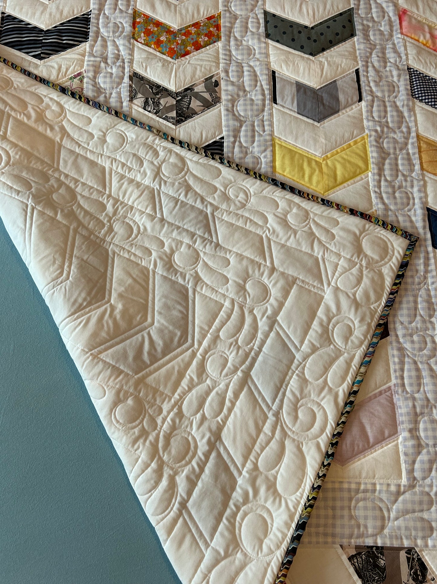 Quilted queen size blanket with embroidery details