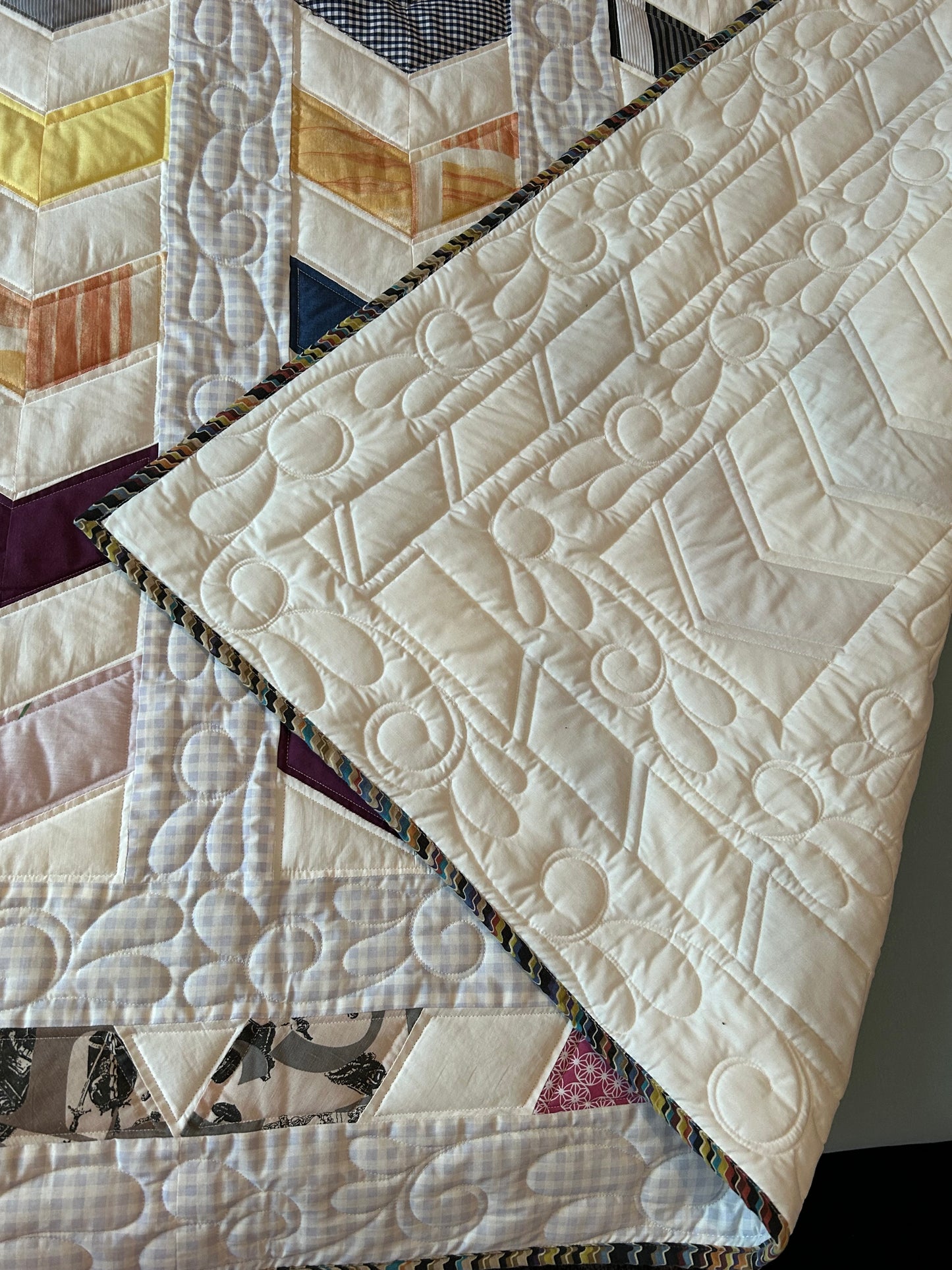 Quilted queen size blanket with embroidery details