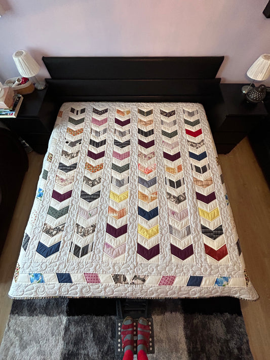 Quilted queen size blanket with embroidery details